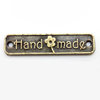 Placa con palabra "handmade", bronce