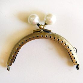 Boquilla de clip circular con perlas 12,5 cm, bronce